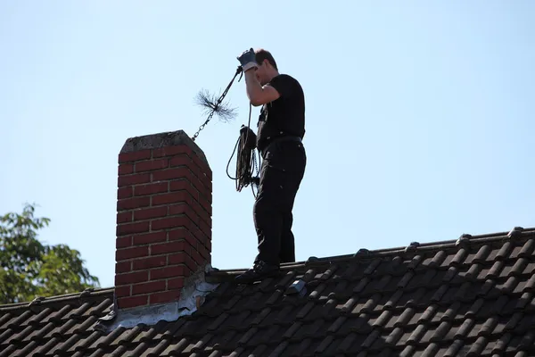 Chimney sweep in action, Boonton NJ